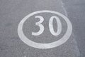 30 speed limit sign painted on a street Royalty Free Stock Photo