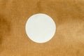 Circular White Sticker on Brown Textured Background Royalty Free Stock Photo