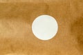 Circular White Sticker on Brown Textured Background Royalty Free Stock Photo