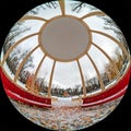 Circular wide angle view from a large gazebo with columns and a park bench