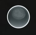Circumference of the neck of the white plastic Cup on a black background