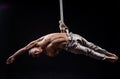 Circus artist on the aerial straps man