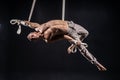 Circus artist on the aerial straps man