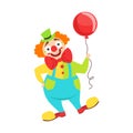 Circus Clown Artist In Classic Outfit With Red Nose And Make Up Holding A Balloon In The Circus Show Royalty Free Stock Photo