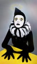 Circus fashion mime posing near a yellow square