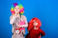 Circus school education. Time to have fun. Kids colorful curly wig clown style hold alarm clock. I am not joking about