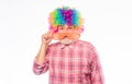 Circus show. Elderly clown. Man senior bearded cheerful person wear colorful rainbow wig. Grandpa always fun. Having fun