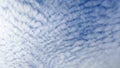 Cirrocumulus clouds in the blue sky.White cirrus clouds in the form of diagonal stripes on the background blue sky Royalty Free Stock Photo