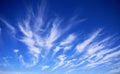 Wispy Clouds Over Deep Blue Sky.