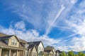 Cirrus clouds against the vivid blue sky over the residential houses at Daybreak, Utah Royalty Free Stock Photo