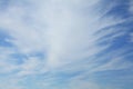 Cirrus clouds on the blue sky background. Thready and abstract sky pattern. Skies landscape i summer. Spindrift clouds