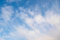 Cirrus clouds on blue sunny spring sky, nature background without focus. Royalty Free Stock Photo