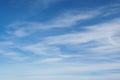 Cirrus clouds on blue sunny spring sky, nature background without focus. Royalty Free Stock Photo