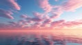 Cirrus clouds tinted pink by the sun at sunset over a calm blue ocean Royalty Free Stock Photo