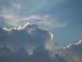 Cirrus, cumulus and nimbostratus clouds on a blue sky