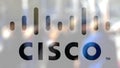 Cisco Systems logo on a glass against blurred crowd on the steet. Editorial 3D rendering Royalty Free Stock Photo
