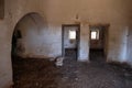 Interior of old abandoned Trulli house with multiple conical roofs in the area of Cisternino / Alberobello in Puglia Italy