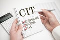 cit, corporate, income, tax, written in notebook on the white background Royalty Free Stock Photo