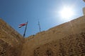 Egyptian flag on top of Citadel of Qaitbay, Egypt. Royalty Free Stock Photo