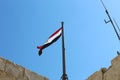 Egyptian flag on top of Citadel of Qaitbay, Egypt. Royalty Free Stock Photo