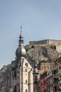 The Citadel towers high above the spire of Notre Dame Church, Dinant, Belgium Royalty Free Stock Photo