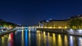 Cite island view with Conciergerie Castle and Pont au Change, over the Seine river timelapse . France, Paris Royalty Free Stock Photo