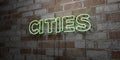 CITIES - Glowing Neon Sign on stonework wall - 3D rendered royalty free stock illustration