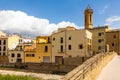 La Bisbal d'Emporda from Castilla. Imposing Romanesque construction, nearby church of Santa Maria de Bisbal. Royalty Free Stock Photo