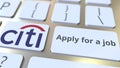 CITIGROUP company logo and Apply for a job text on the keys of the computer keyboard, editorial conceptual 3D rendering Royalty Free Stock Photo