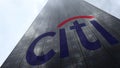 Citigroup logo on a skyscraper facade reflecting clouds, time lapse. Editorial 3D rendering