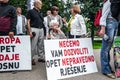 Citizens protesting with posters against the amendment of the electoral law in Sarajevo