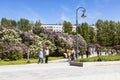 Citizens walk in the Lilac garden on a summer day. Moscow