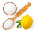 Citric acid in a wooden plate and spoon with lemon isolated. Lemon acid top view Royalty Free Stock Photo