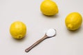 Citric acid in wooden spoon and fresh lemons Royalty Free Stock Photo