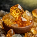 Rough citrine crystal stones in a wooden bowl, on a layer of citrine stones, close-up image