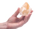 Citrine point in woman`s hand