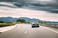 Citroen C4 Cactus Car Goes On Highway Road On Background Of Spanish Mountain Nature Landscape. C4 Cactus Is A Mini