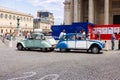 Citroen 2CV cars parked in the bustling street of Paris