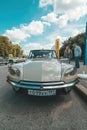 Citroen DS car parked on street, front view of classic french auto