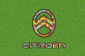 Citroen Logo with colorful flowers on green background