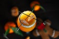 Citrus alcohol coctail with tangerine juce and grenadine in wineglass with mandarine slice. Top view Royalty Free Stock Photo