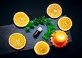 Citrus aroma oil concept Ã¢â¬â glass bottle with essence, ripe juicy orange slices