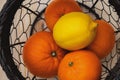 Fruits in a basket on a kitchen table top view