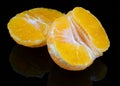 Citrus clementine wedges on a black background Royalty Free Stock Photo