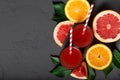 Citrus drink, fresh citrus smoothie juice at dark background top view Royalty Free Stock Photo