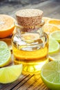 Citrus essential oil and slice of orange, lemon and lime fruits