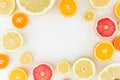 Citrus frame of lemon, orange, grapefruit, sweetie and pomelo fruits on white background. Flat lay, top view.