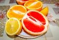 Citrus fruit cut in half on the table in a plate Royalty Free Stock Photo