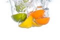 Citrus fruit falling in water Royalty Free Stock Photo