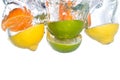 Citrus fruit falling in water Royalty Free Stock Photo